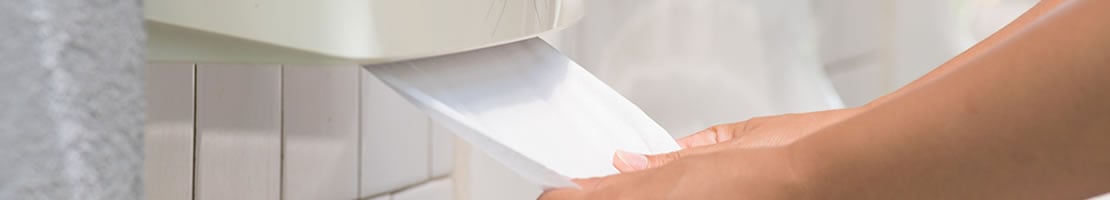 A paper towel dispenser in a public washroom